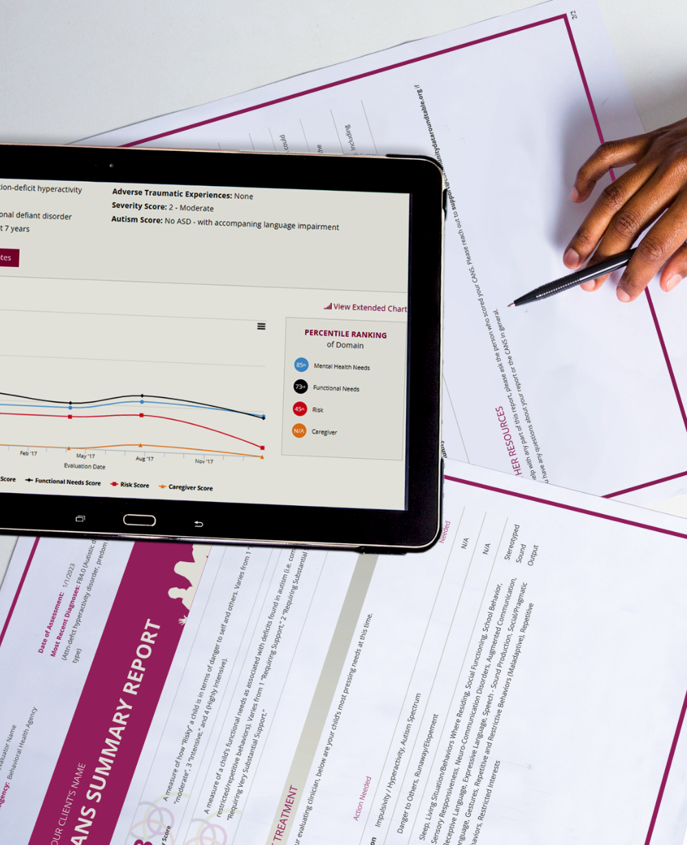 ipad with statistical results sitting atop printed pages with other results