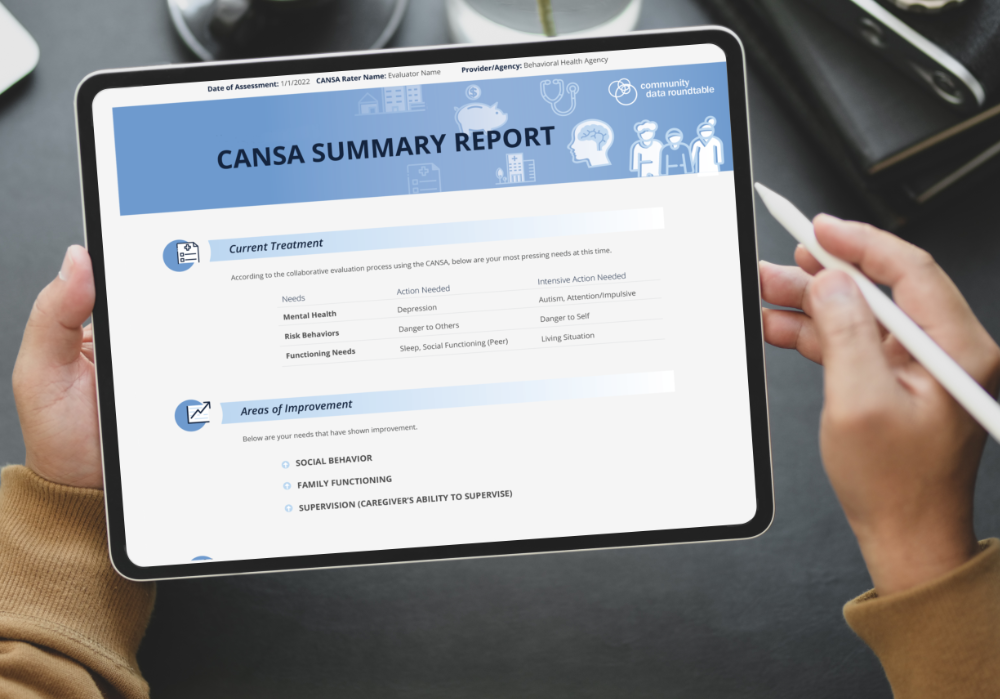 person holding a tablet with example of the reports displayed on the screen